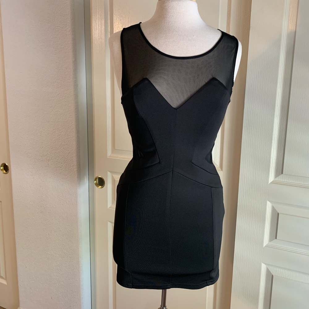 Black mini dress with mesh cutout detail.